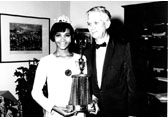 Commissioner August Heckscher greets Miss Harlem 1967 at the Arsenal. (September 5, 1967)